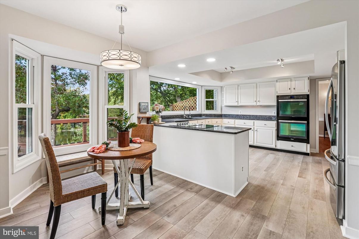 Dining room, Interior, Kitchen, Pendant Lights, Recessed Lighting, Stainless Steel Appliances, Wood Texture Flooring