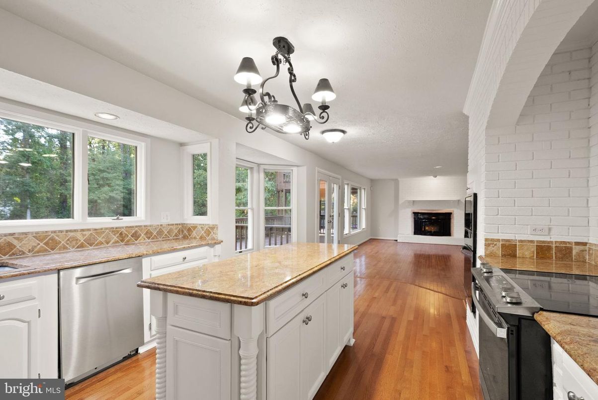 Chandelier, Fireplace, Interior, Kitchen, Recessed Lighting, Wood Texture Flooring