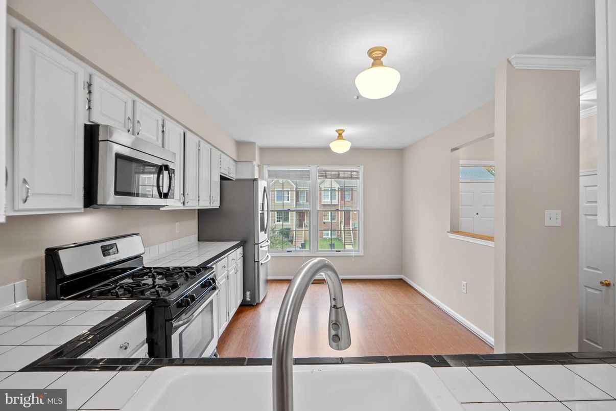 Interior, Kitchen, Tile Countertops, Wood Texture Flooring