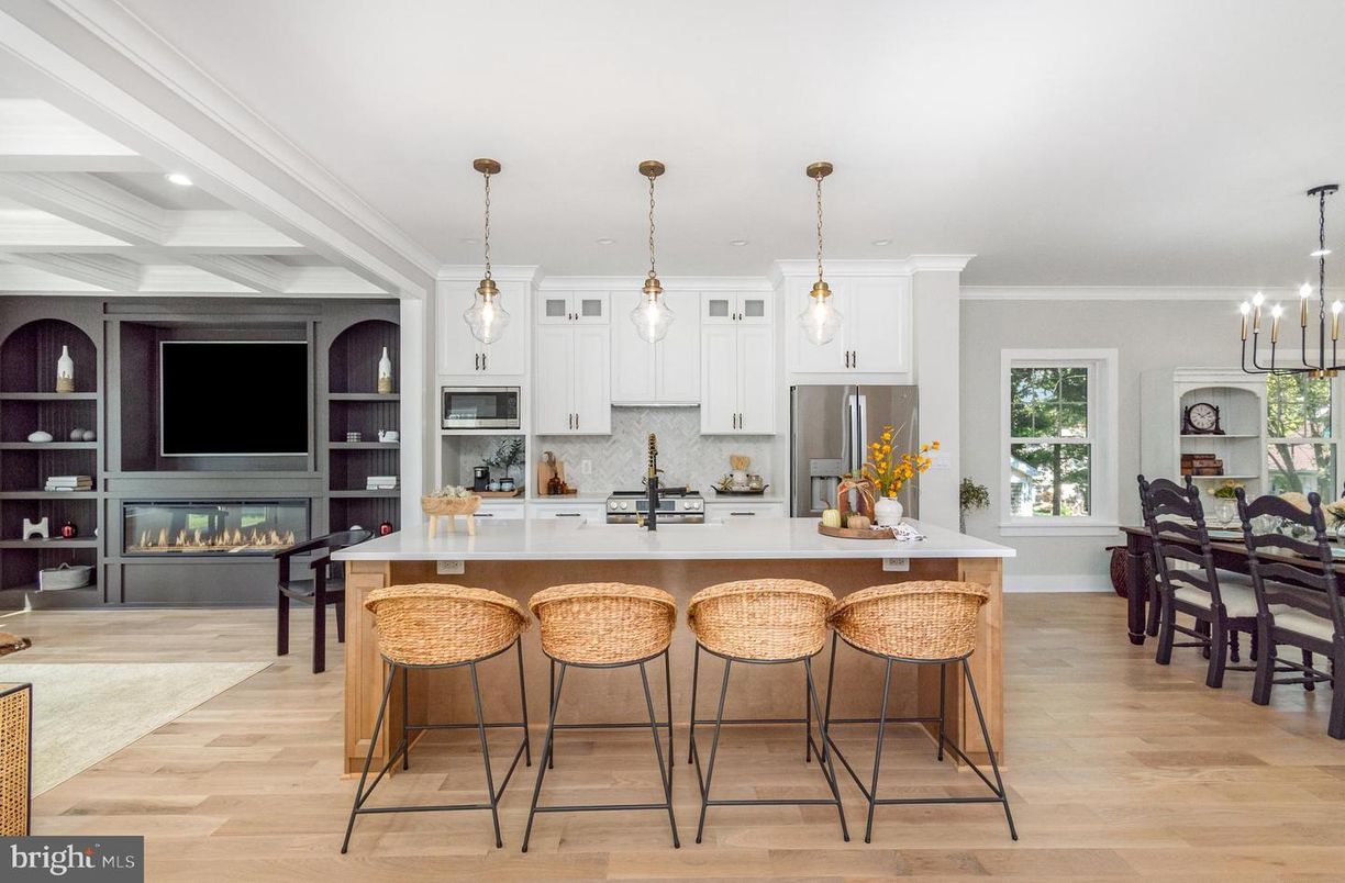 Chandelier, Fireplace, Interior, Kitchen, Pendant Lights, Recessed Lighting, Stainless Steel Appliances, Wood Texture Flooring