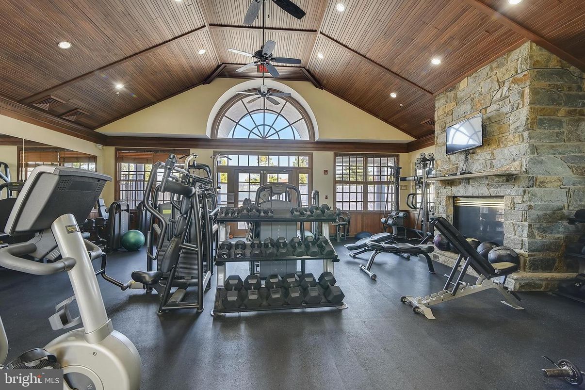 Fireplace, Fitness Equipment, Gym, Interior, Recessed Lighting, Stone Walls