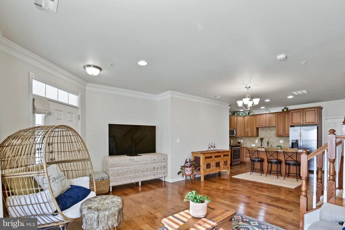 Chandelier, Interior, Kitchen, Living room, Recessed Lighting, Stainless Steel Appliances, Wood Texture Flooring