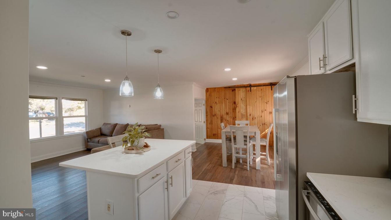 Dining room, Interior, Kitchen, Marble, Pendant Lights, Recessed Lighting, Stainless Steel Appliances, Wood Texture Flooring, Wooden Walls
