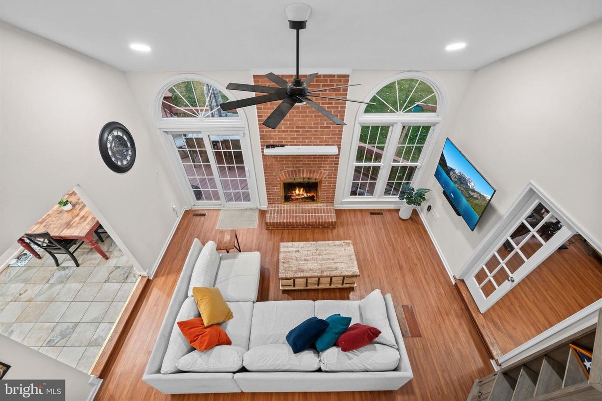 Fireplace, Interior, Living room, Recessed Lighting, Stone Walls, Wood Texture Flooring