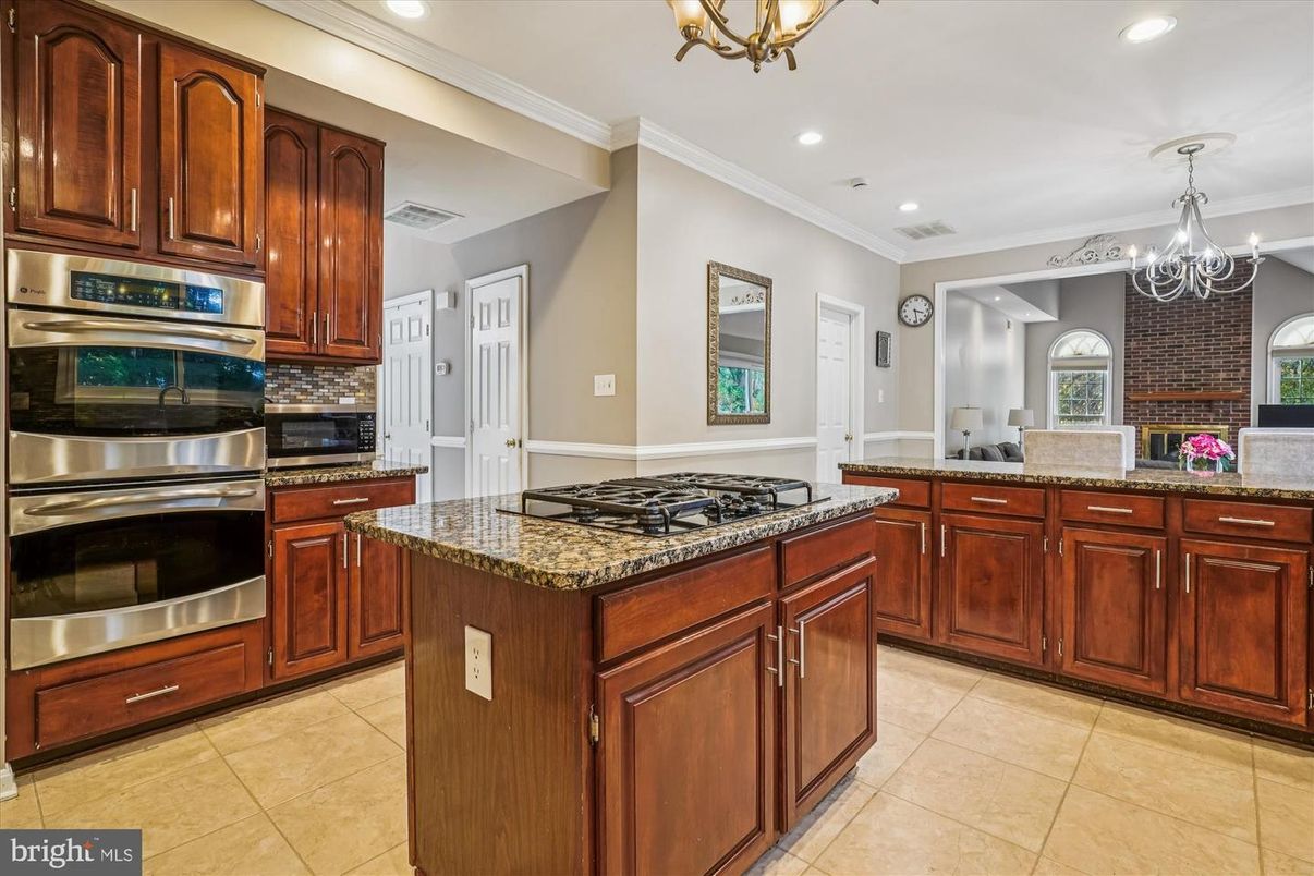 Chandelier, Fireplace, Interior, Kitchen, Recessed Lighting, Stainless Steel Appliances