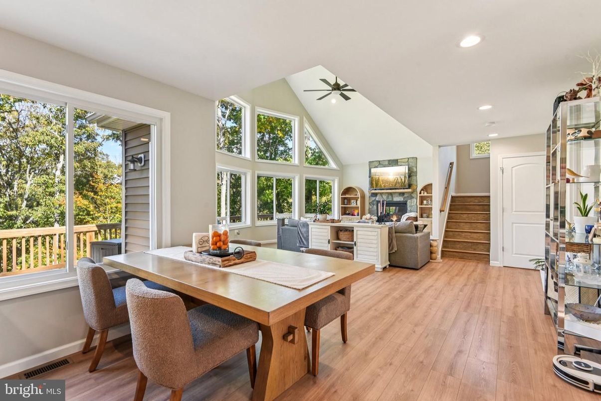 Dining room, Fireplace, Interior, Living room, Recessed Lighting, Wood Texture Flooring