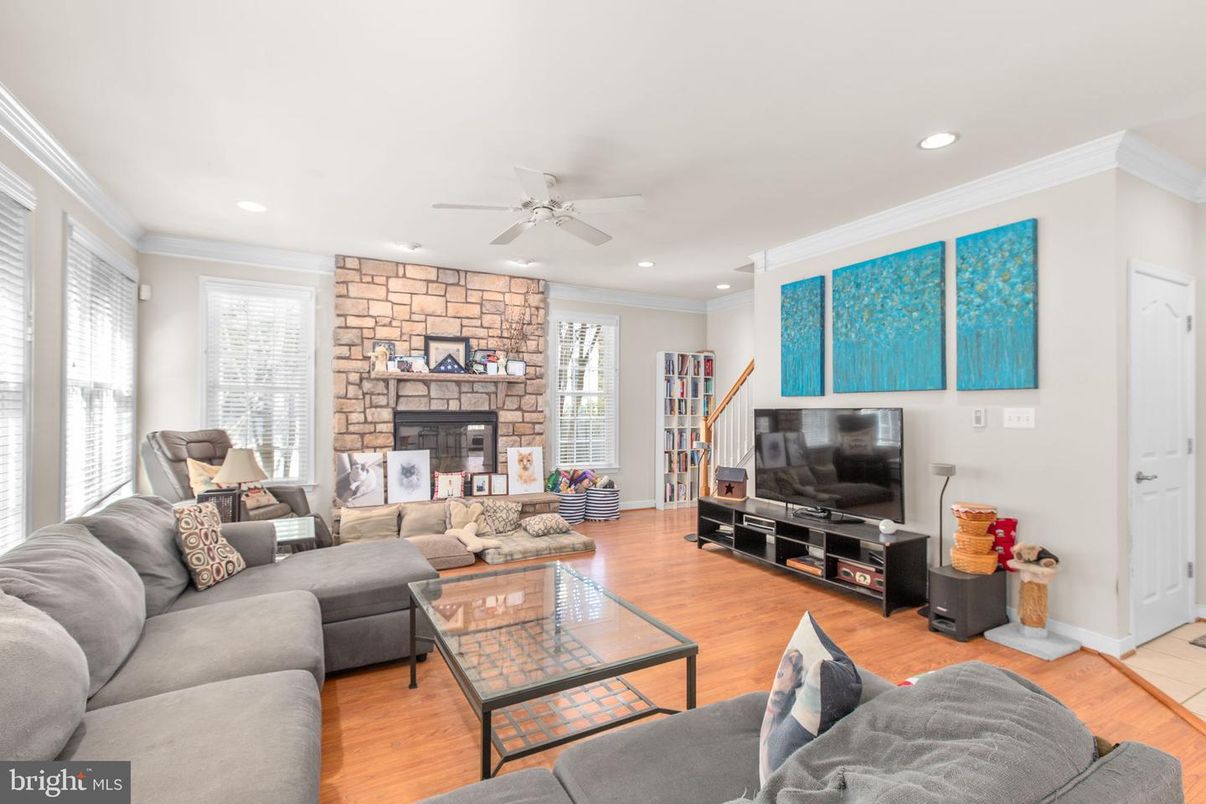 Fireplace, Interior, Living room, Recessed Lighting, Stone Walls, Wood Texture Flooring