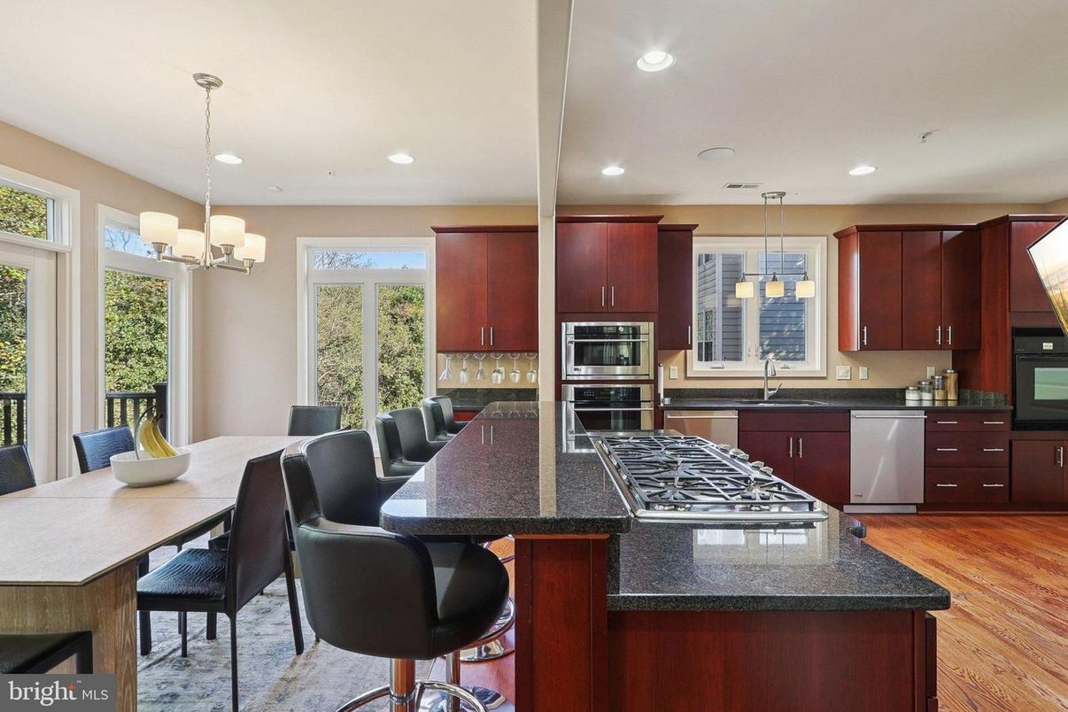 Chandelier, Dining room, Interior, Kitchen, Pendant Lights, Recessed Lighting, Stainless Steel Appliances, Wood Texture Flooring