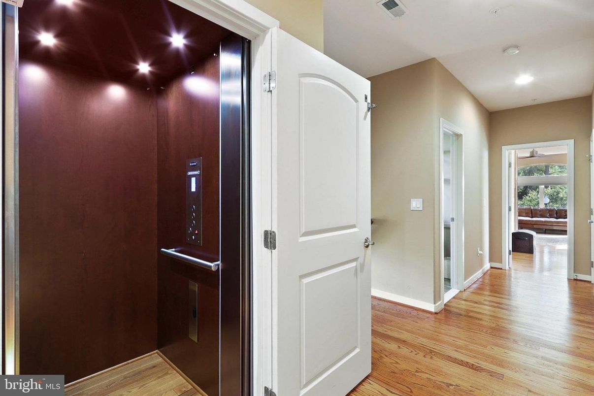 Elevator, Interior, Recessed Lighting, Wood Texture Flooring, Wooden Walls