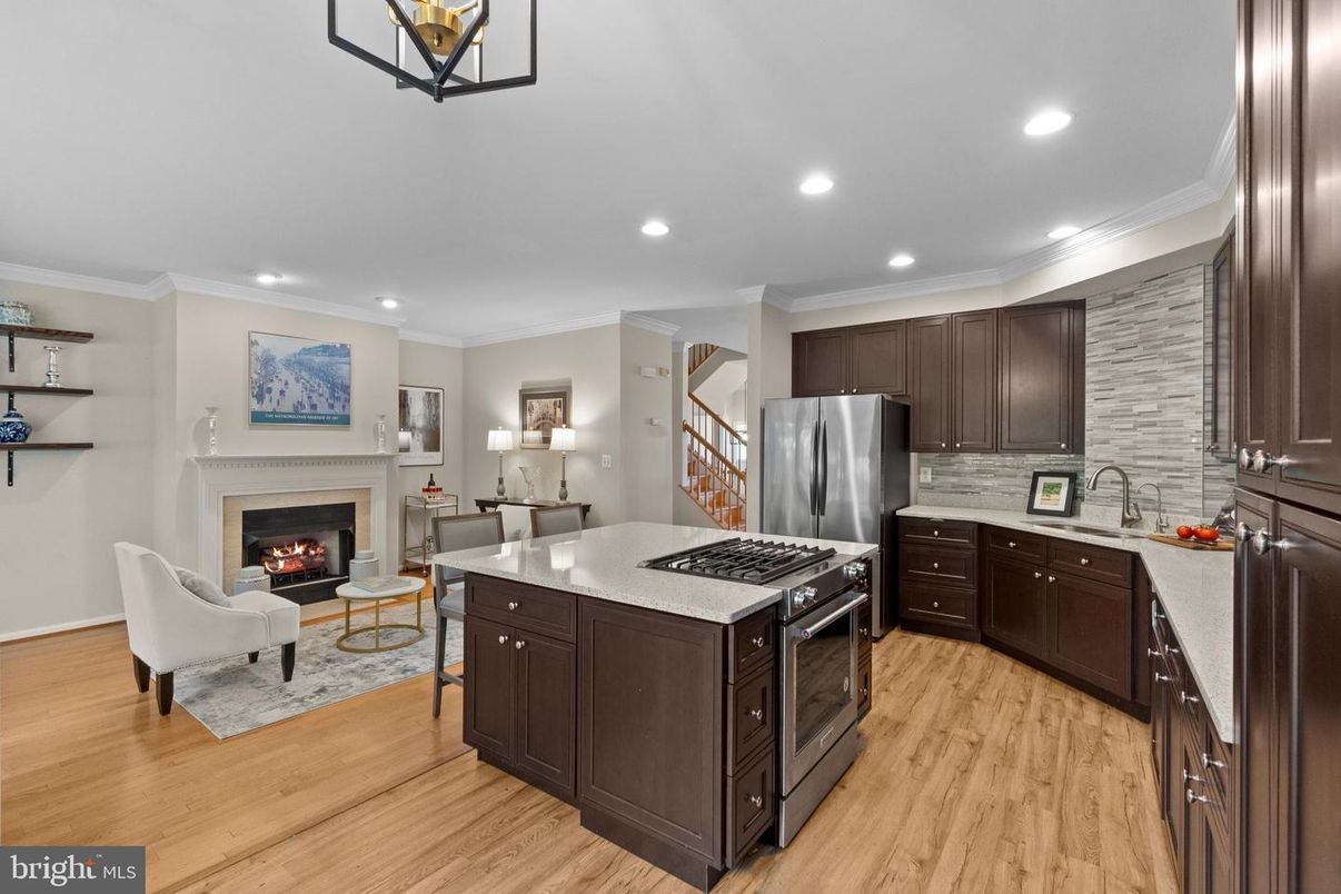 Fireplace, Interior, Kitchen, Living room, Recessed Lighting, Stainless Steel Appliances, Wood Texture Flooring