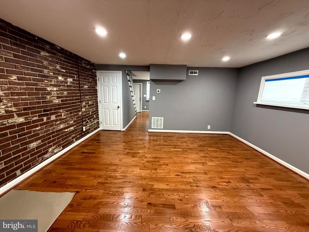 Empty room, Interior, Recessed Lighting, Stone Walls, Wood Texture Flooring