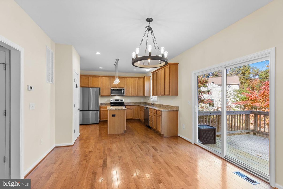 Chandelier, Interior, Kitchen, Pendant Lights, Recessed Lighting, Stainless Steel Appliances, Wood Texture Flooring