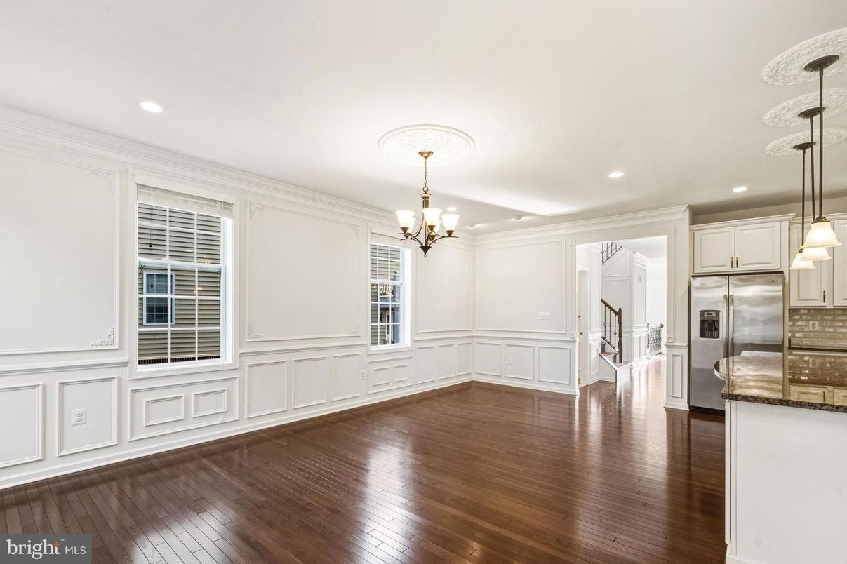 Chandelier, Empty room, Interior, Kitchen, Recessed Lighting, Stainless Steel Appliances, Wood Texture Flooring
