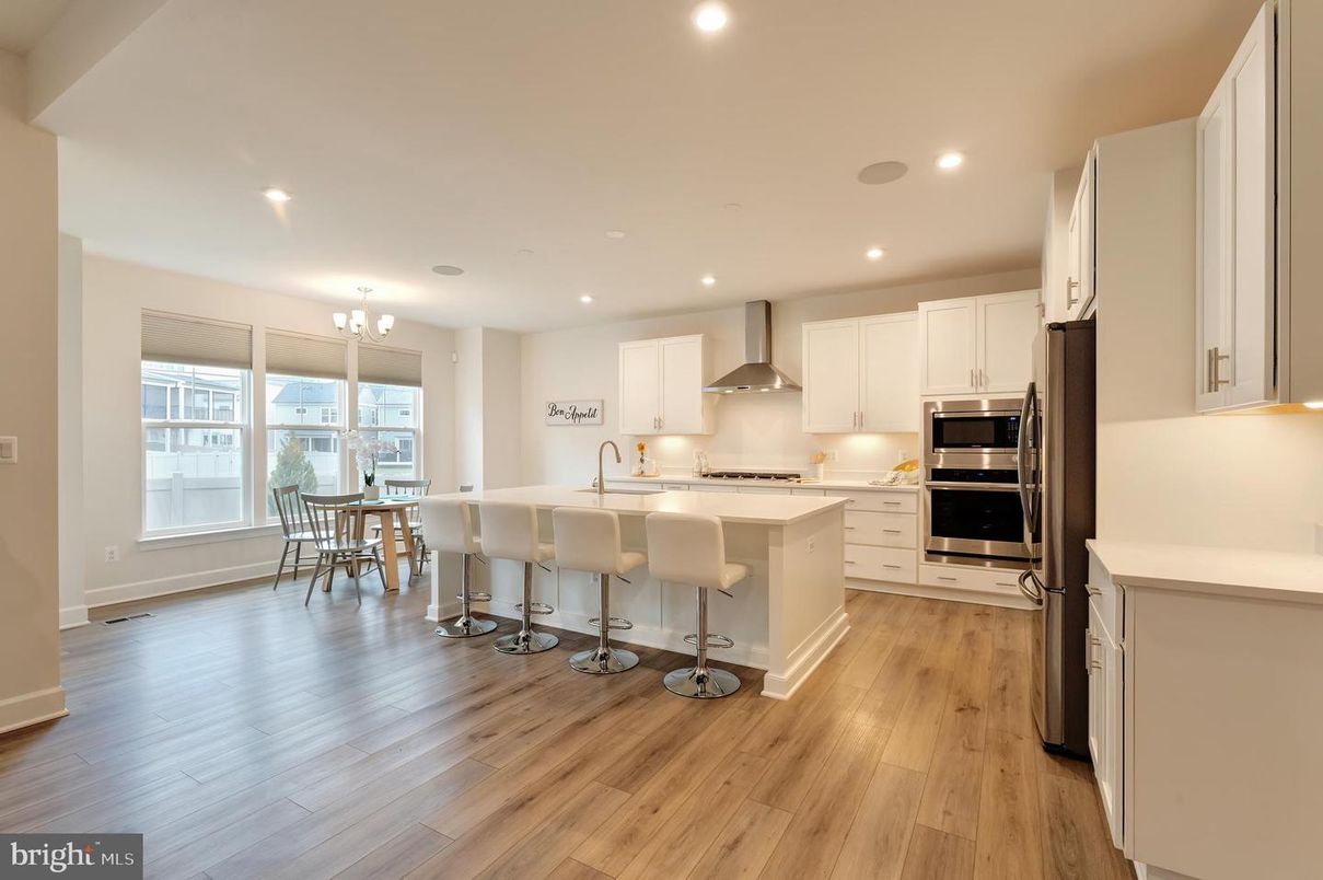 Chandelier, Dining room, Interior, Kitchen, Recessed Lighting, Stainless Steel Appliances, Wood Texture Flooring