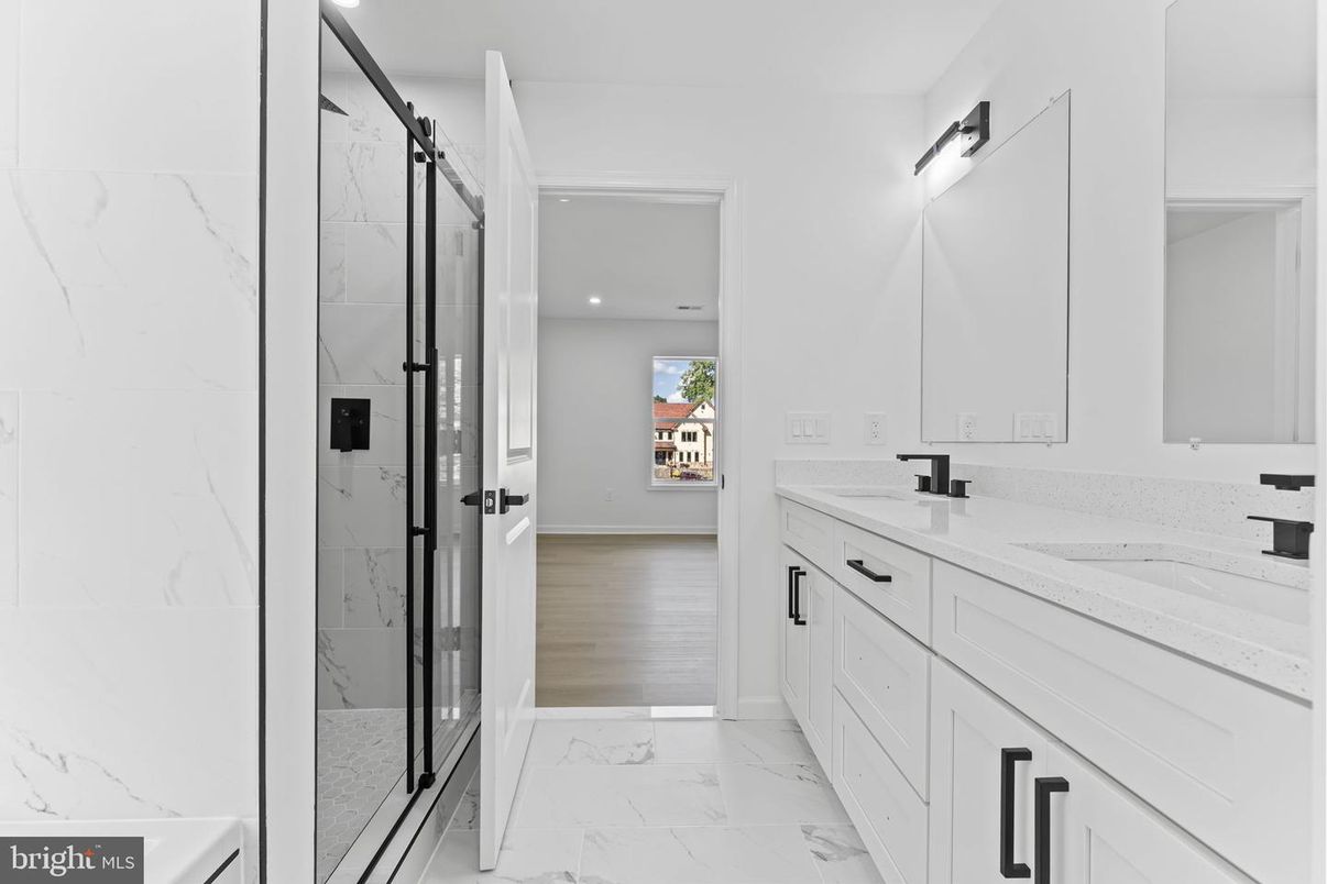 Bathroom, Dual Sink Vanities, Glass Shower, Interior, Marble, Marble Walls, Recessed Lighting