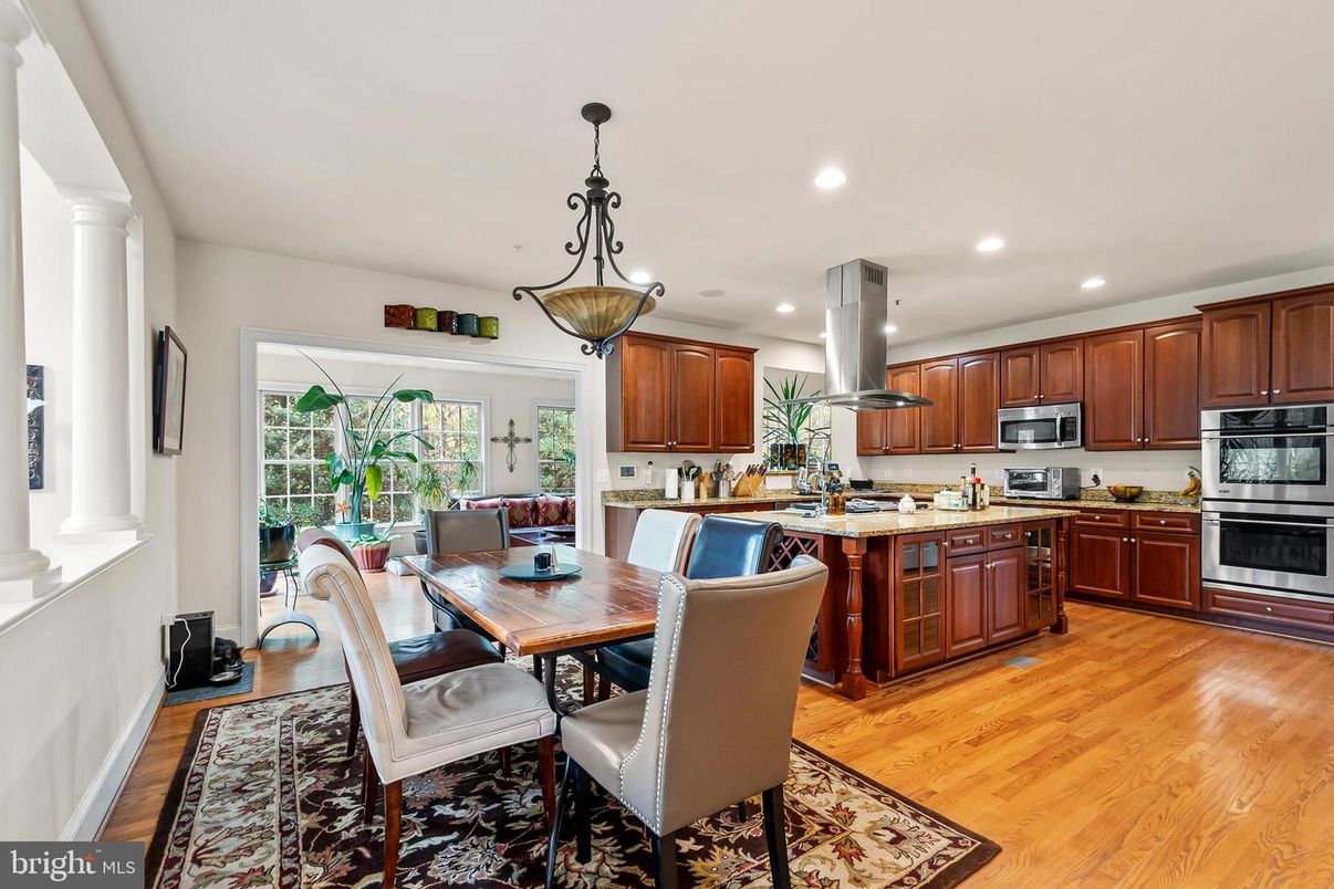 Dining room, Interior, Kitchen, Pendant Lights, Recessed Lighting, Stainless Steel Appliances, Wood Texture Flooring
