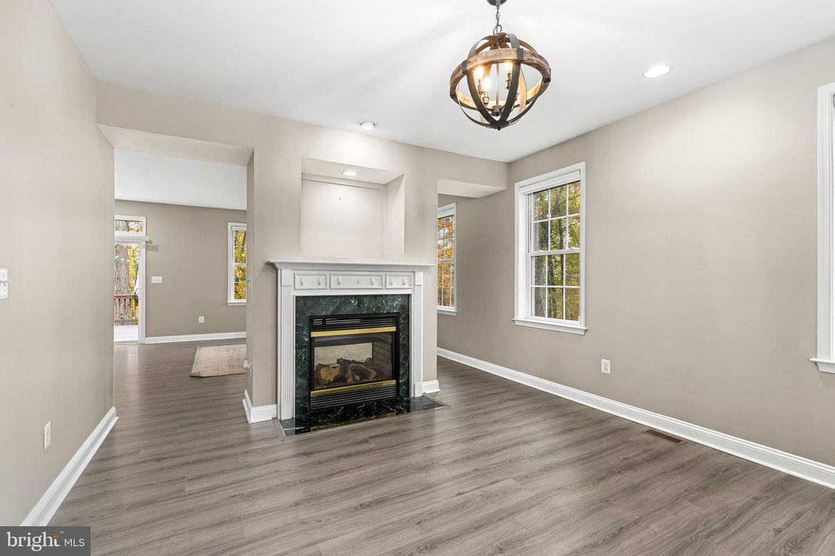 Empty room, Fireplace, Interior, Pendant Lights, Recessed Lighting, Wood Texture Flooring