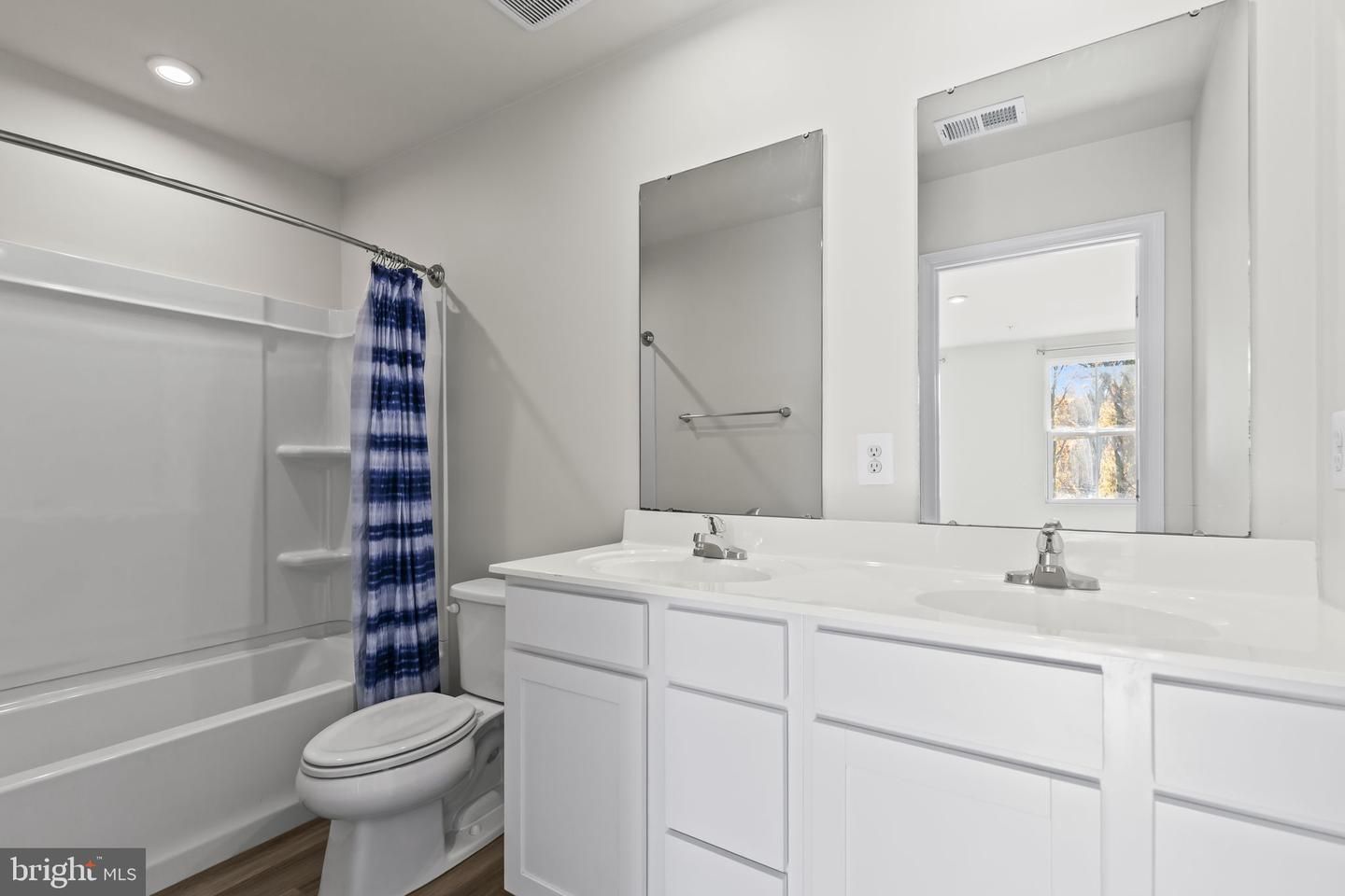 Bathroom, Dual Sink Vanities, Interior, Recessed Lighting, Wood Texture Flooring