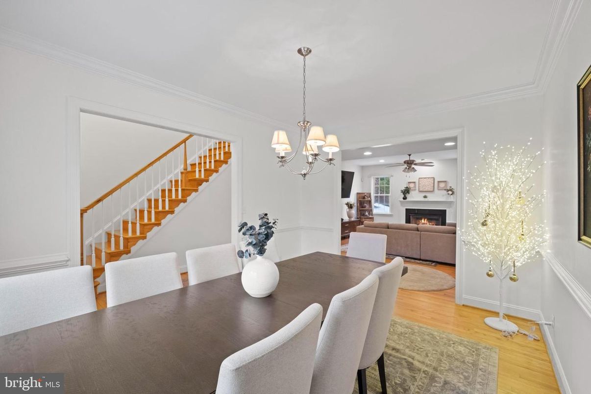 Chandelier, Dining room, Fireplace, Interior, Living room, Pendant Lights, Recessed Lighting, Wood Texture Flooring