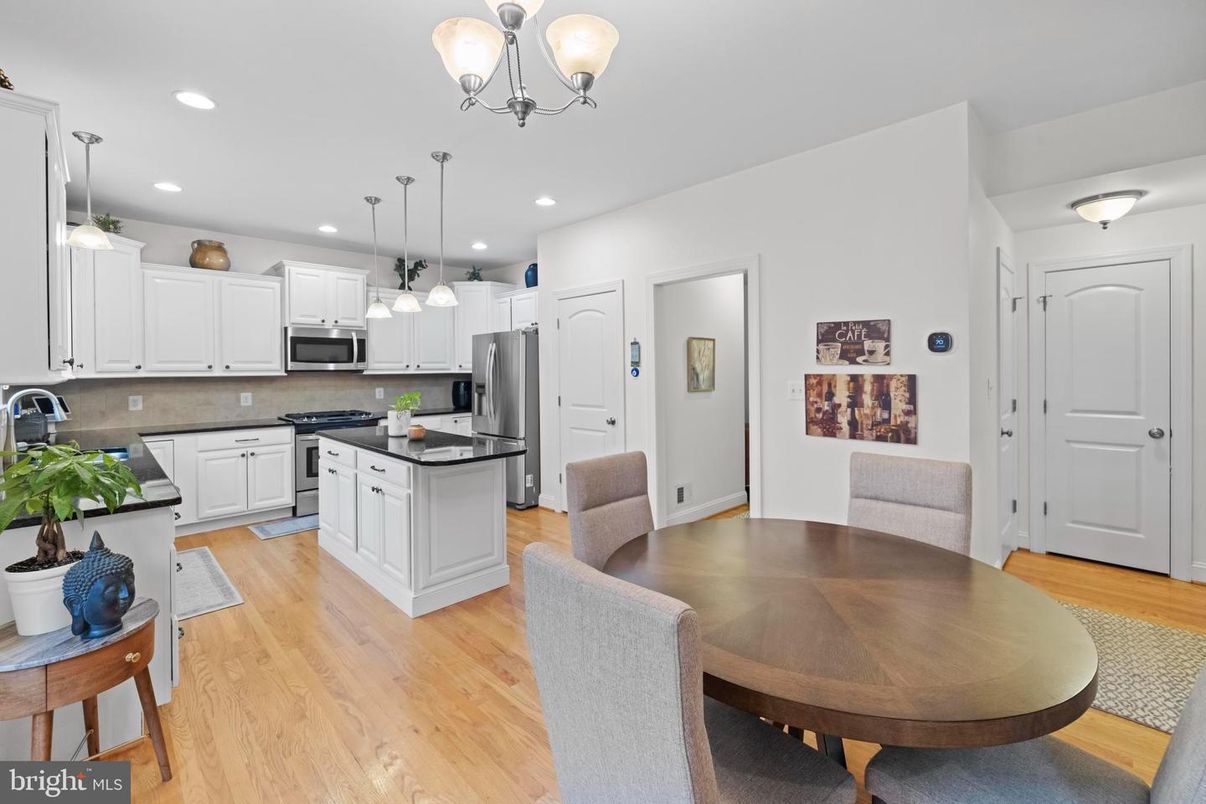 Dining room, Interior, Kitchen, Pendant Lights, Recessed Lighting, Stainless Steel Appliances, Wood Texture Flooring