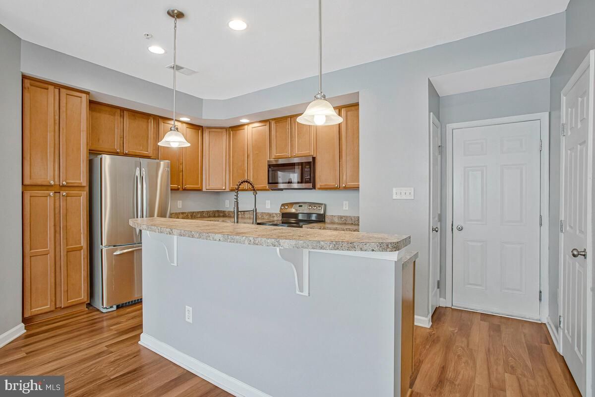 Interior, Kitchen, Pendant Lights, Recessed Lighting, Stainless Steel Appliances, Wood Texture Flooring