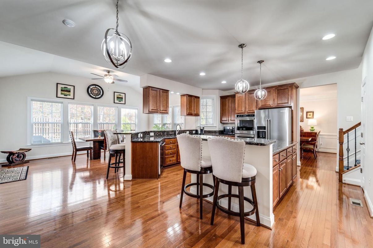 Dining room, Interior, Kitchen, Pendant Lights, Recessed Lighting, Stainless Steel Appliances, Wood Texture Flooring