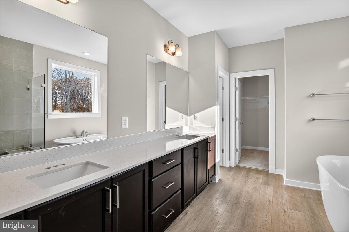 Bathroom, Dual Sink Vanities, Glass Shower, Interior, Recessed Lighting, Wood Texture Flooring