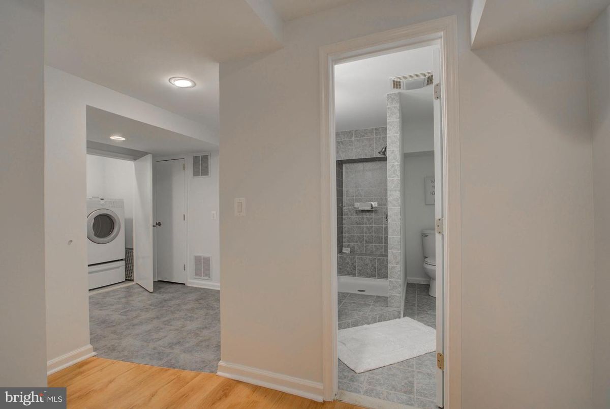 Bathroom, Interior, Recessed Lighting, Utility Closets, Washer, Wood Texture Flooring