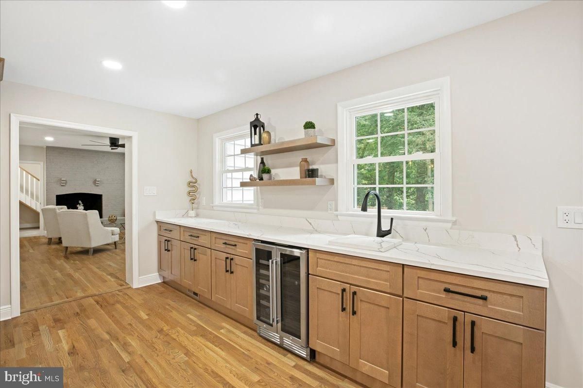 Dining room, Fireplace, Interior, Kitchen, Recessed Lighting, Stone Walls, Wood Texture Flooring
