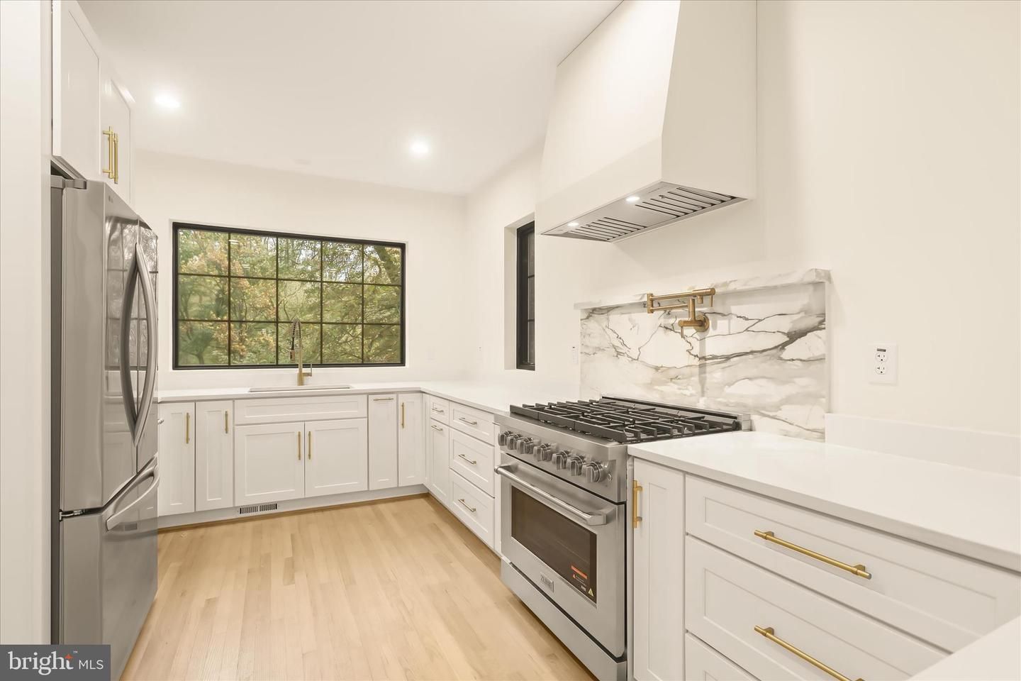 Interior, Kitchen, Marble Walls, Recessed Lighting, Stainless Steel Appliances, Wood Texture Flooring