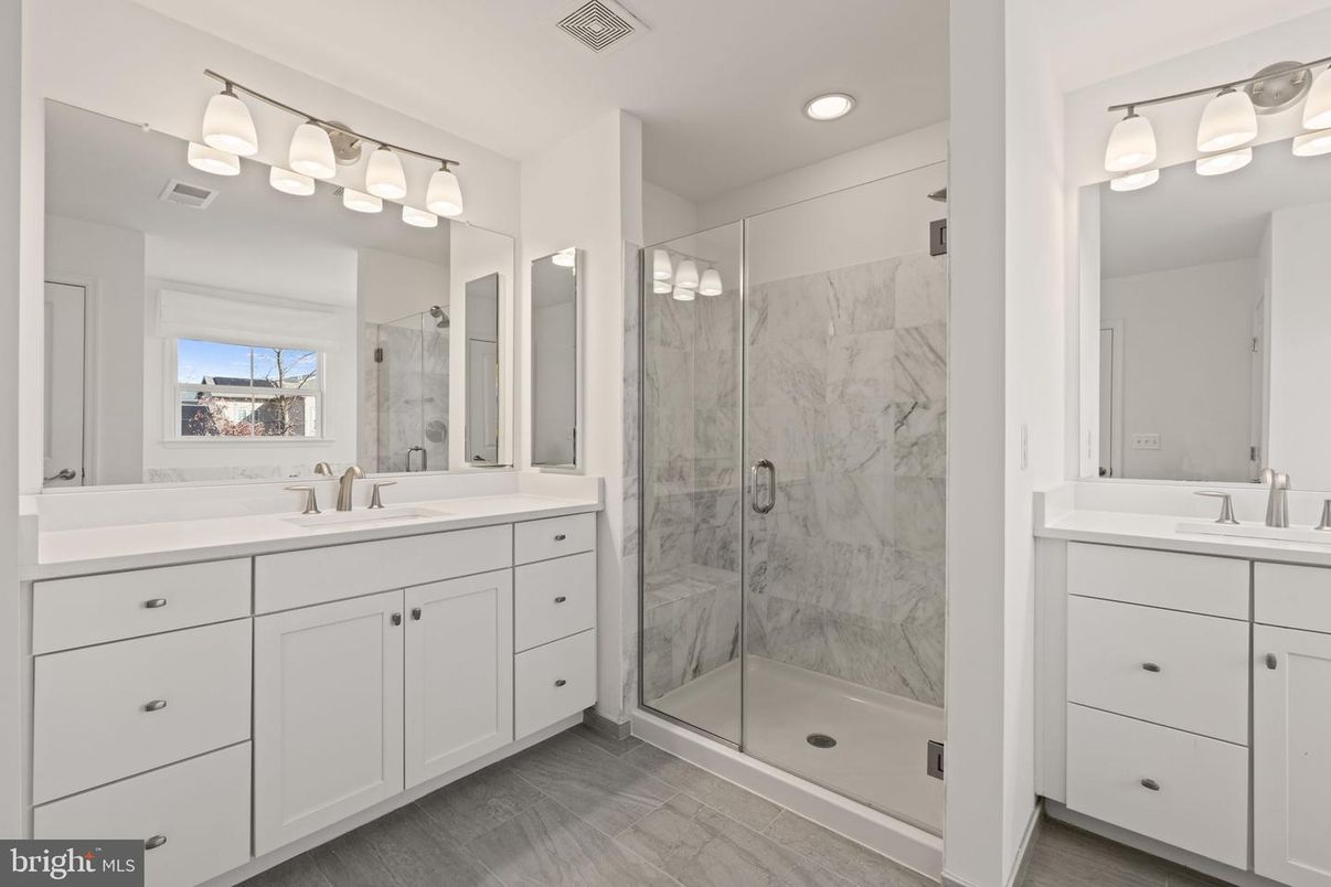Bathroom, Dual Sink Vanities, Glass Shower, Interior, Marble Walls, Recessed Lighting