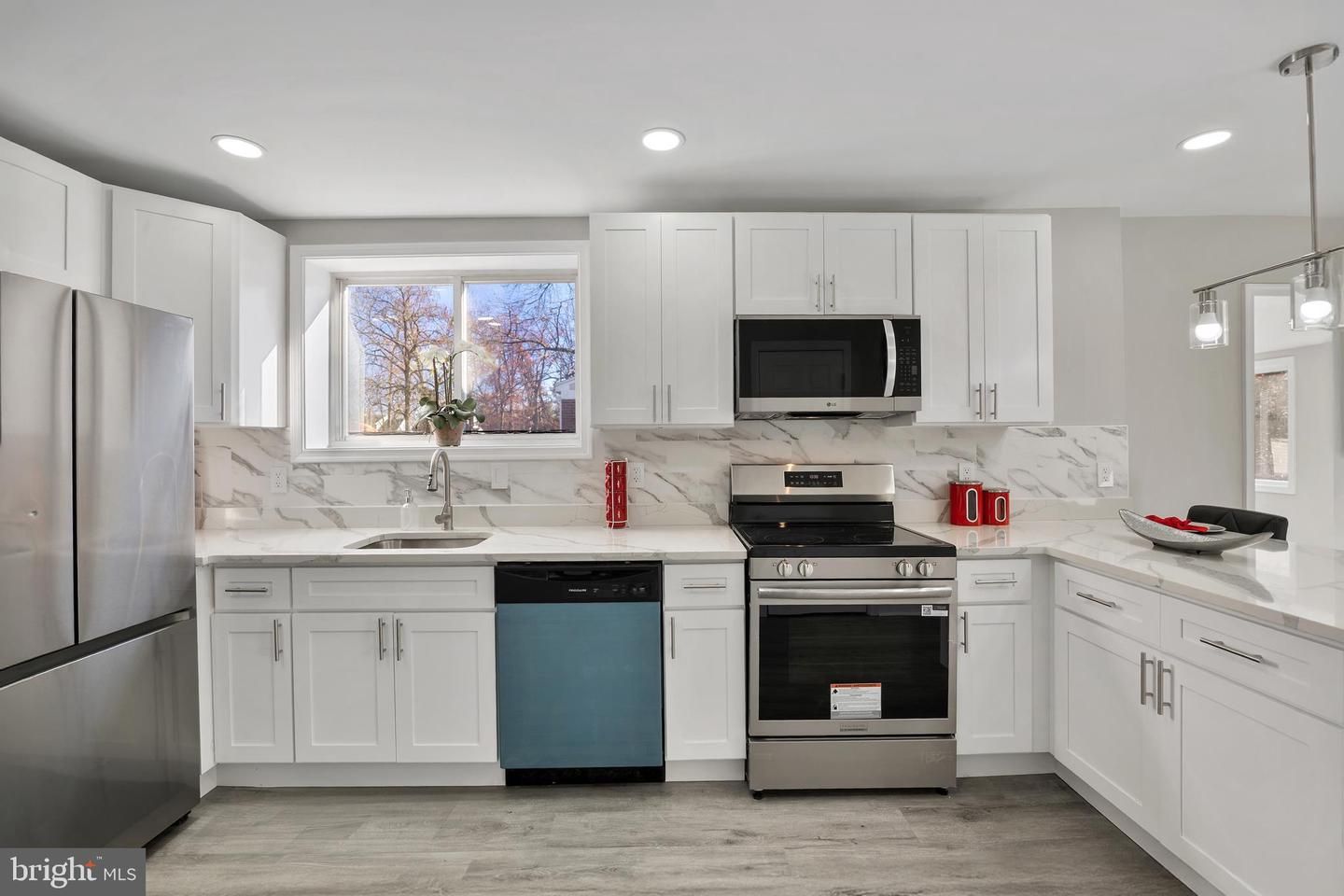 Interior, Kitchen, Marble Walls, Pendant Lights, Recessed Lighting, Stainless Steel Appliances, Wood Texture Flooring