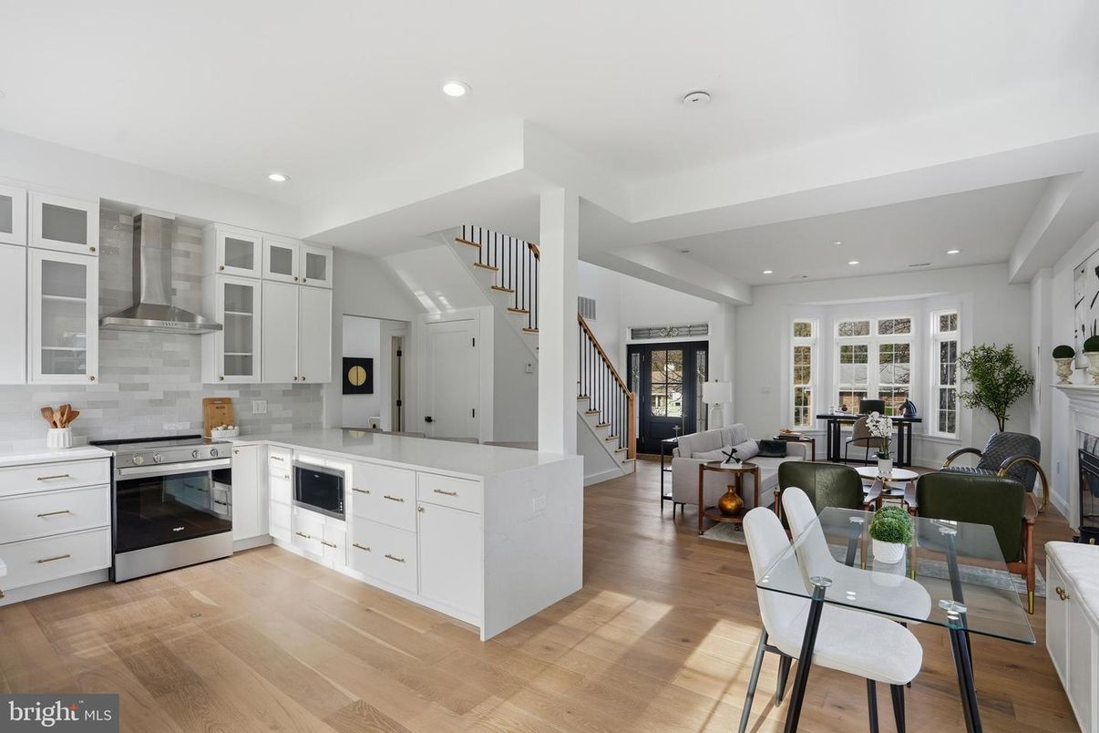 Dining room, Fireplace, Interior, Kitchen, Living room, Recessed Lighting, Stainless Steel Appliances, Wood Texture Flooring