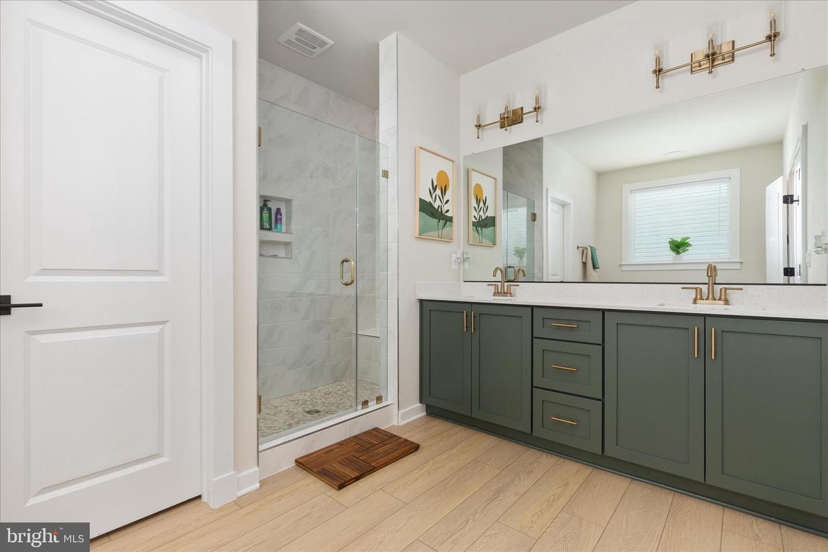 Bathroom, Dual Sink Vanities, Glass Shower, Interior, Marble Walls, Wood Texture Flooring