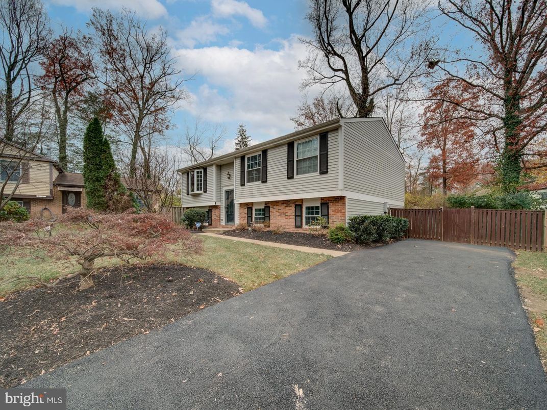 Attached, Backyard, Exterior, Facade, Brick Facade, Raised Ranch