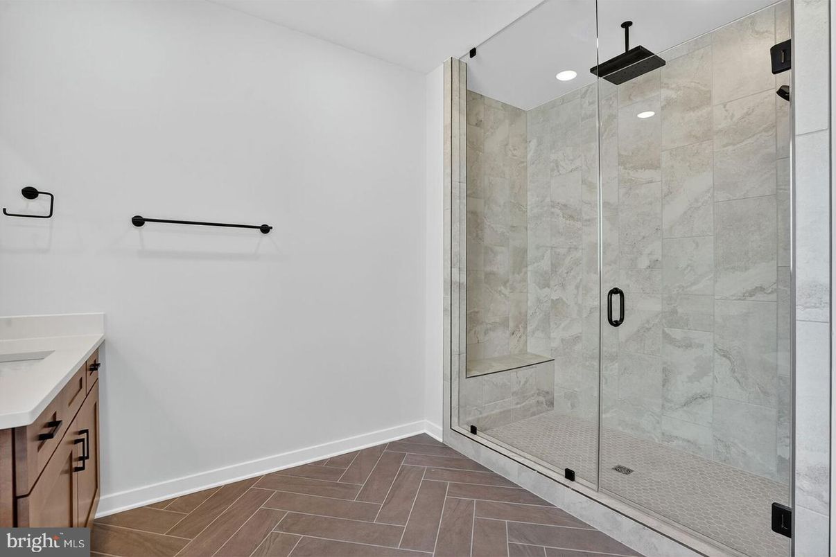 Bathroom, Glass Shower, Interior, Marble Walls, Recessed Lighting, Wood Texture Flooring