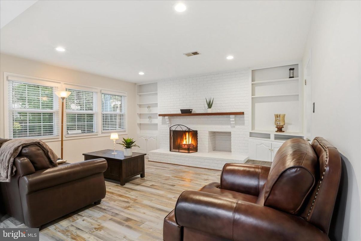 Fireplace, Interior, Living room, Recessed Lighting, Stone Walls, Wood Texture Flooring