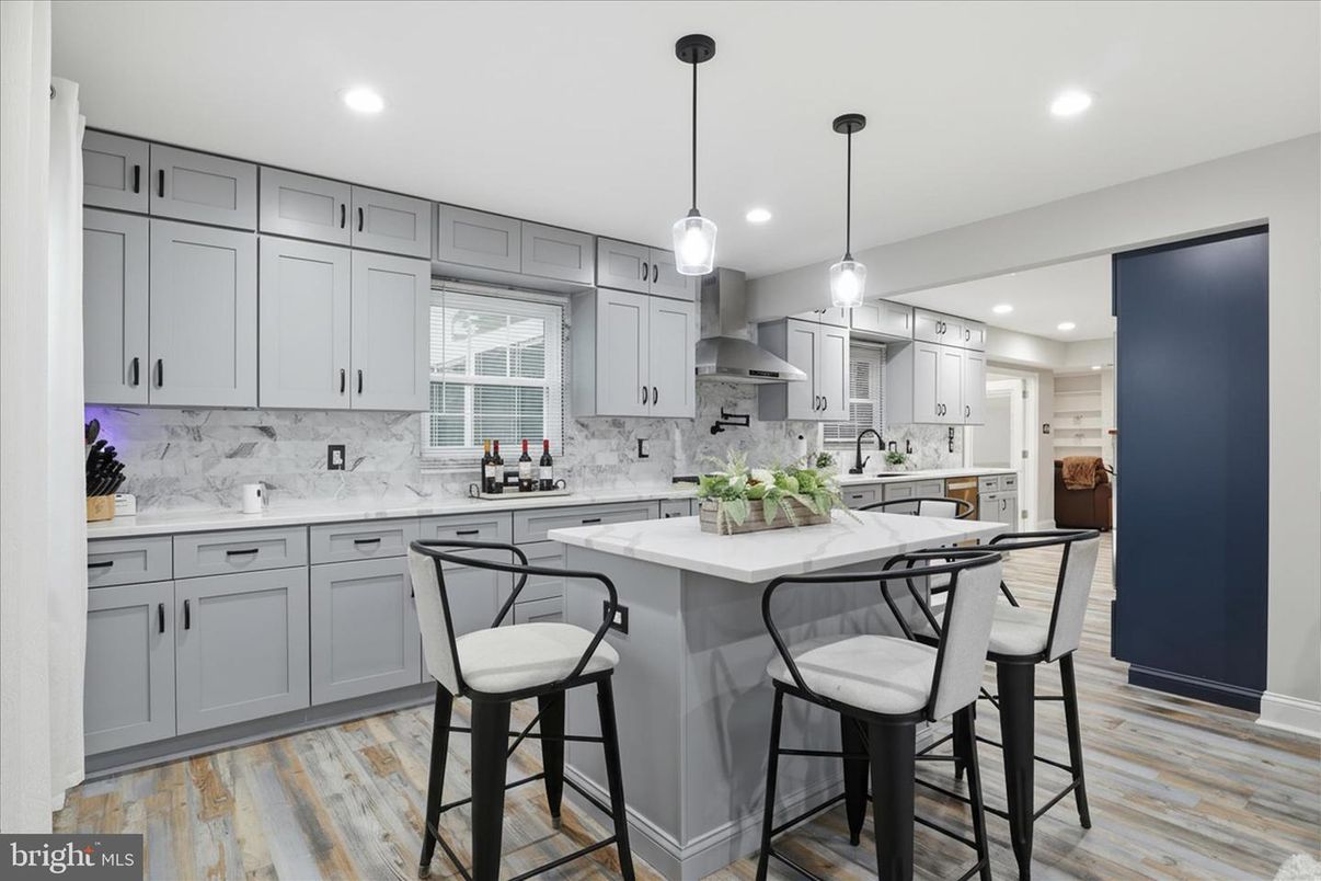 Interior, Kitchen, Marble Walls, Pendant Lights, Recessed Lighting, Stainless Steel Appliances, Wood Texture Flooring