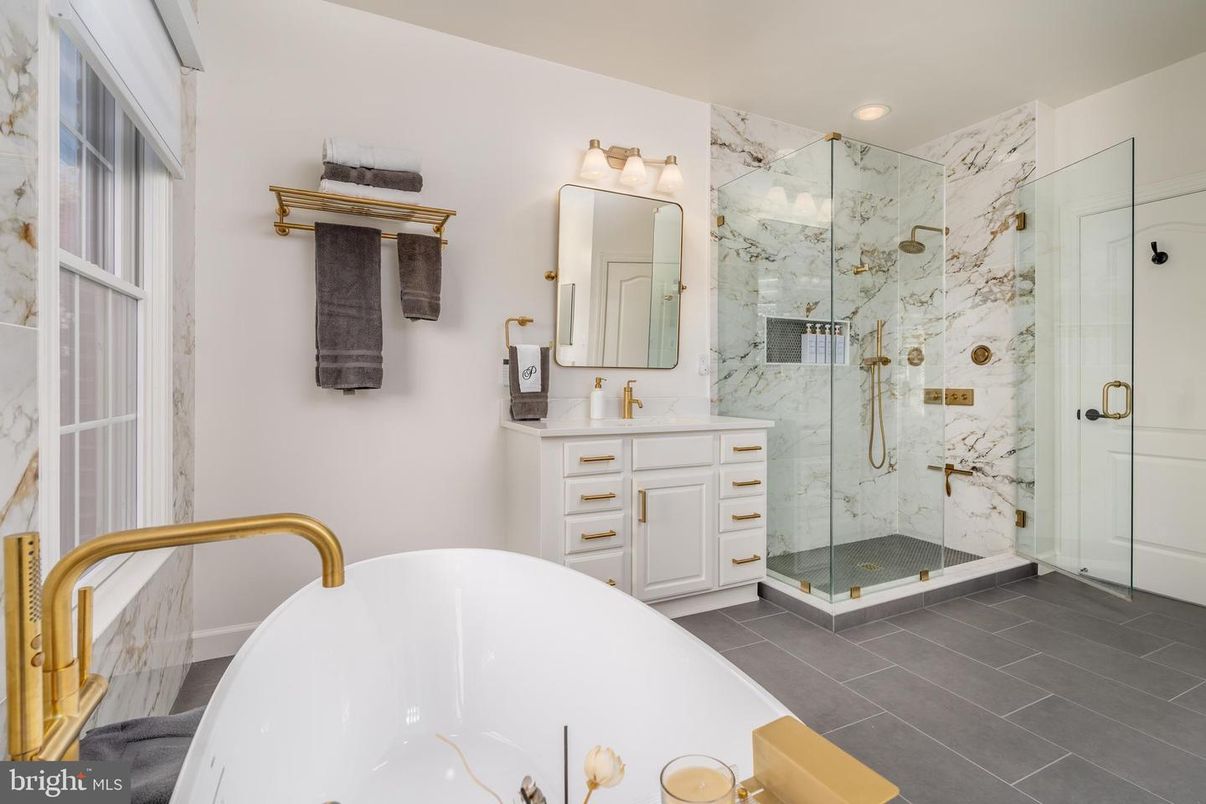 Bathroom, Dual Sink Vanities, Free Standing Baths, Glass Shower, Interior, Marble Walls, Recessed Lighting