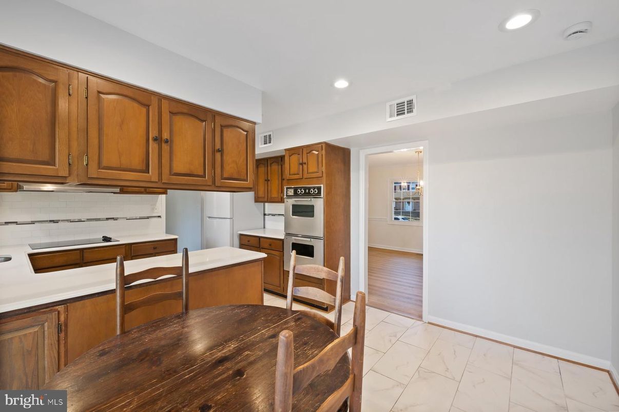 Dining room, Interior, Kitchen, Marble, Recessed Lighting, Stainless Steel Appliances, Wood Texture Flooring