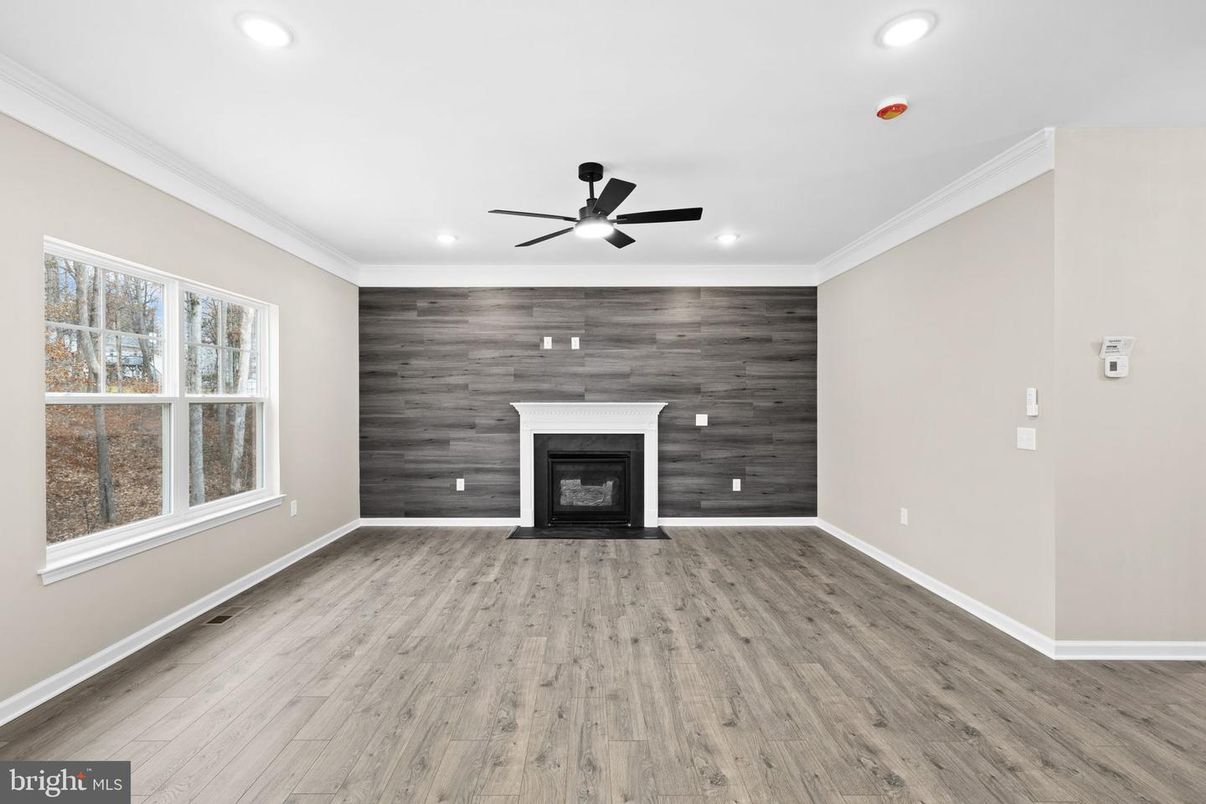 Empty room, Fireplace, Interior, Recessed Lighting, Wood Texture Flooring, Wooden Walls