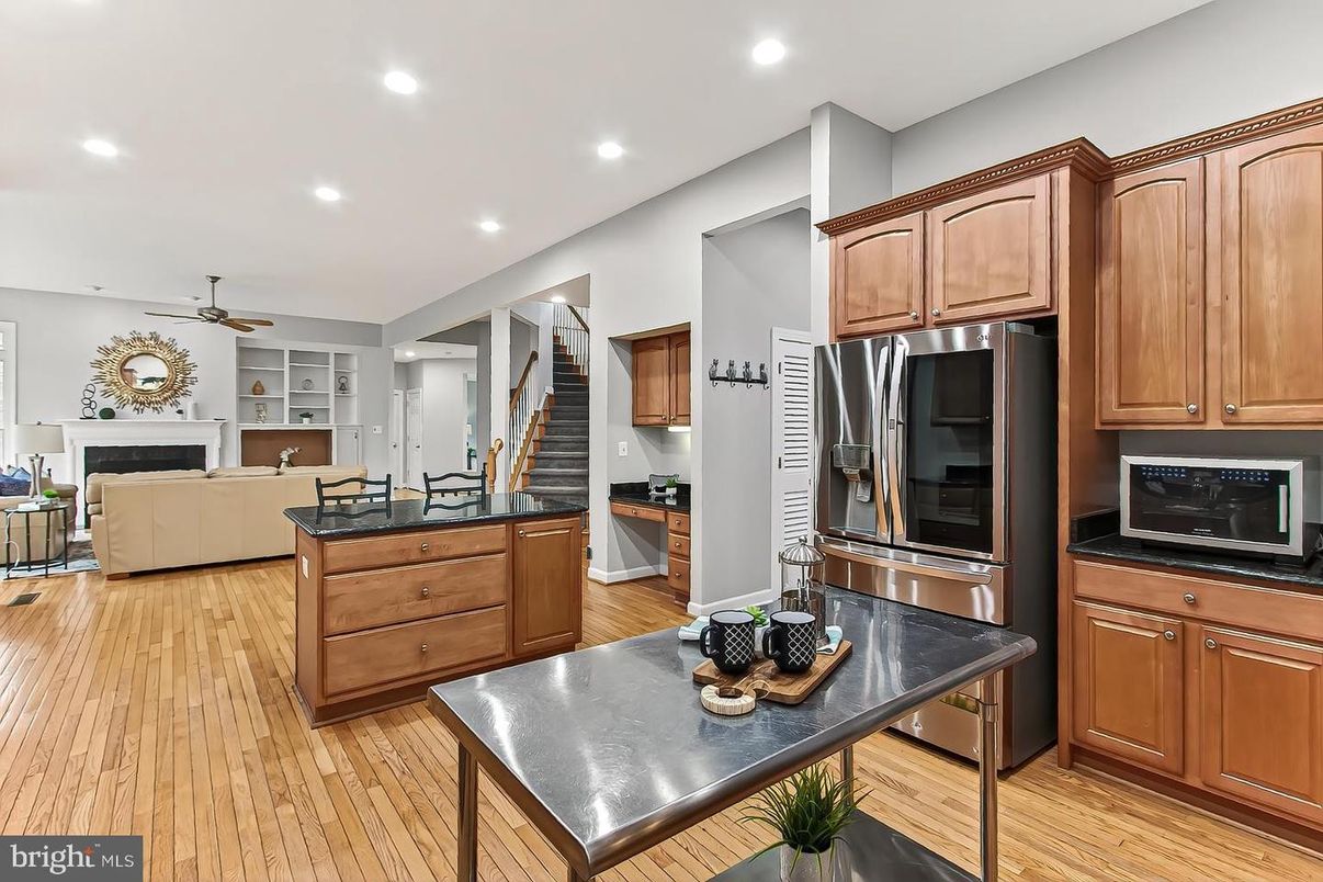 Fireplace, Interior, Kitchen, Living room, Recessed Lighting, Stainless Steel Appliances, Wood Texture Flooring