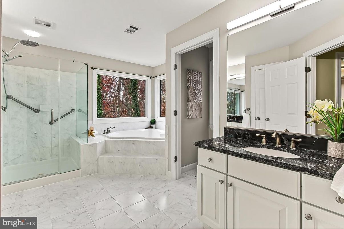 Bathroom, Dual Sink Vanities, Glass Shower, Interior, Marble, Marble Walls, Recessed Lighting