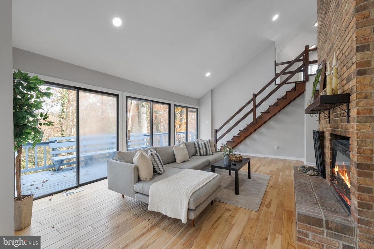 Fireplace, Interior, Living room, Recessed Lighting, Stone Walls, Wood Texture Flooring