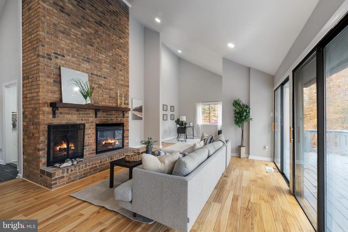 Fireplace, Interior, Living room, Recessed Lighting, Stone Walls, Wood Texture Flooring