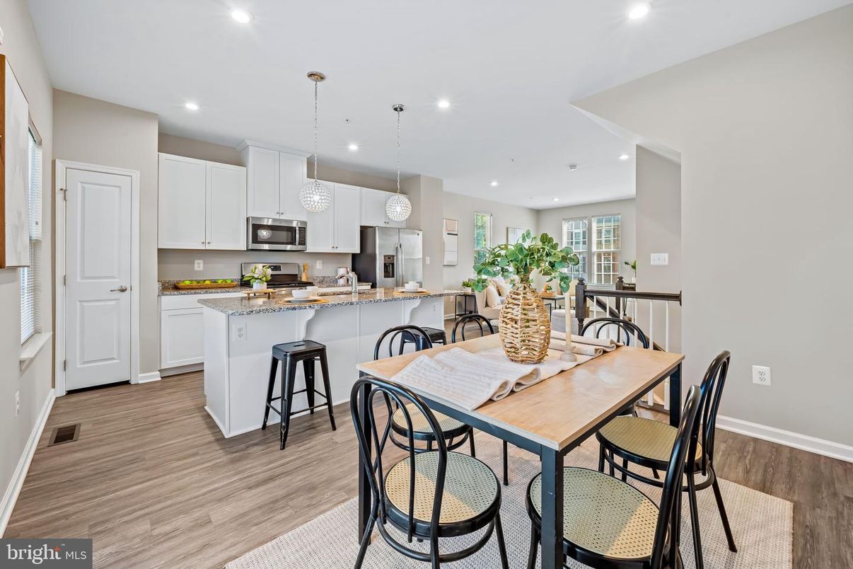 Dining room, Interior, Kitchen, Pendant Lights, Recessed Lighting, Stainless Steel Appliances, Wood Texture Flooring