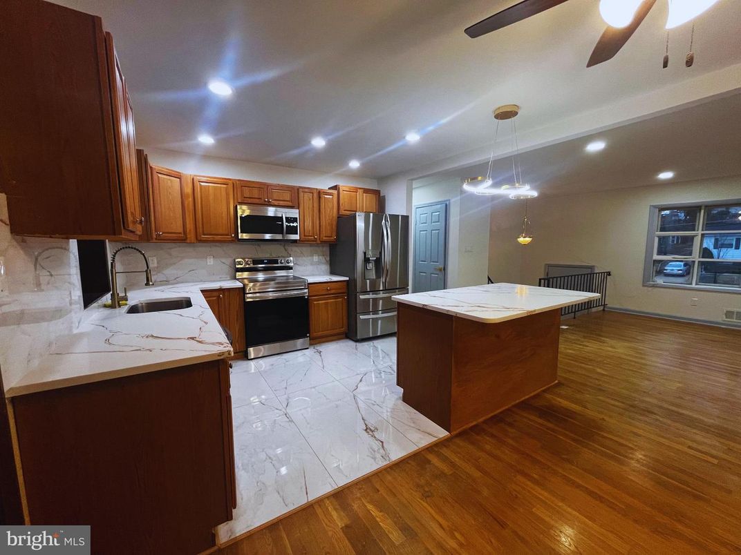 Interior, Kitchen, Marble, Pendant Lights, Recessed Lighting, Stainless Steel Appliances, Wood Texture Flooring
