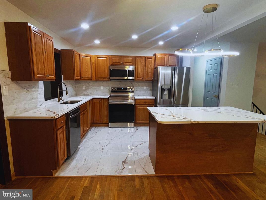 Interior, Kitchen, Marble, Pendant Lights, Recessed Lighting, Stainless Steel Appliances, Wood Texture Flooring