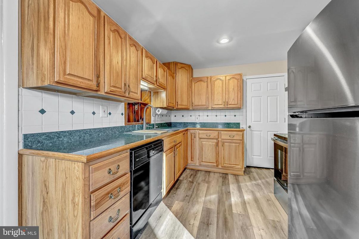 Interior, Kitchen, Recessed Lighting, Tile Countertops, Wood Texture Flooring