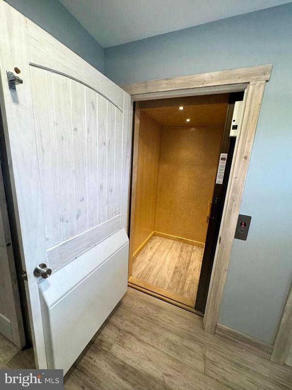 Elevator, Interior, Recessed Lighting, Wood Texture Flooring, Wooden Walls